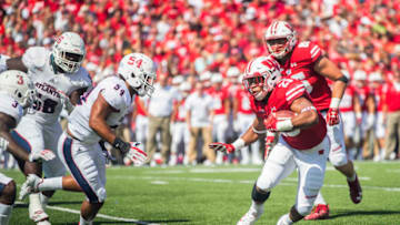 MADISON, WI - SEPTEMBER 09: UW running back Jonathon Taylor (23) runs with the ball while FAU line backer Hosea Barnwell, V (54) attempts a tackle duringan NCAA football game between the Florida Atlantic Owls and the Wisconsin Badgers on September 9, 2017 at Camp Randall Stadium in Madison, WI. (Photo by Lawrence Iles/Icon Sportswire via Getty Images)