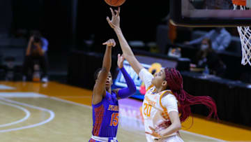 Jan 31, 2021; Knoxville, Tennessee, USA; Tennessee Lady Vols center Tamari Key (20) blocks a shot from Florida Gators guard Nina Rickards (15) during the first half at Thompson-Boling Arena. Mandatory Credit: Randy Sartin-USA TODAY Sports