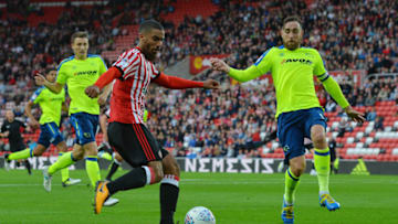 SUNDERLAND, ENGLAND - AUGUST 04: Lewis Grabban of Sunderland takes on Richard Keogh of Derby County during the Sky Bet Championship match between Sunderland and Derby County at Stadium of Light on August 4, 2017 in Sunderland, England. (Photo by Mark Runnacles/Getty Images)