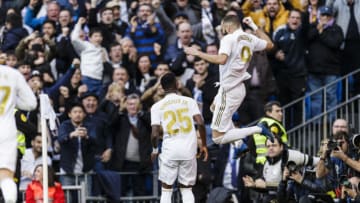 MADRID, SPAIN - FEBRUARY 01: Karim Benzema of Real Madrid (R) celebrates his goal during the Liga match between Real Madrid CF and Club Atletico de Madrid at Estadio Santiago Bernabeu on February 1, 2020 in Madrid, Spain. (Photo by Ricardo Nogueira/Eurasia Sport Images/Getty Images)