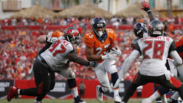Oct 2, 2016; Tampa, FL, USA; Denver Broncos running back Devontae Booker (23) runs with the ball against the Tampa Bay Buccaneers during the second half at Raymond James Stadium. Mandatory Credit: Kim Klement-USA TODAY Sports