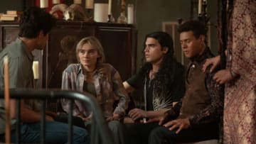 The Winchesters -- "Legend of a Mind" -- Image Number: WHS105a_0377r.jpg -- Pictured (L-R): Drake Rodger as John Winchester, Meg Donnelly as Mary Campbell, JoJo Fleites as Carlos Cervantez and Tyler Lofton as Tony -- Photo: Elliot Brasseaux/The CW -- © 2022 The CW Network, LLC. All Rights Reserved.