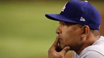 PHOENIX, ARIZONA - JUNE 04: Manager Dave Roberts #30 of the Los Angeles Dodgers watches from the dugout during the seventh inning of the MLB game against the Arizona Diamondbacks at Chase Field on June 04, 2019 in Phoenix, Arizona. (Photo by Christian Petersen/Getty Images)