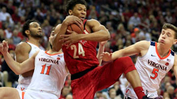 LOUISVILLE, KENTUCKY - FEBRUARY 23: Dwayne Sutton #24 of the Louisville Cardinals rebounds the ball in the game against the Virginia Cavaliers during the first half at KFC YUM! Center on February 23, 2019 in Louisville, Kentucky. (Photo by Justin Casterline/Getty Images)