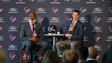 Feb 8, 2022; Houston, TX, USA; Houston Texans new head coach Lovie Smith (left) and general manager Nick Caserio (right) speak during the introductory press conference at NRG Stadium. Mandatory Credit: Maria Lysaker-USA TODAY Sports
