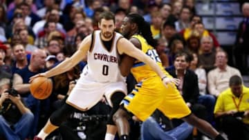 Nov 7, 2014; Denver, CO, USA; Denver Nuggets forward Kenneth Faried (35) guards Cleveland Cavaliers forward Kevin Love (0) in the second quarter at the Pepsi Center. Mandatory Credit: Isaiah J. Downing-USA TODAY Sports
