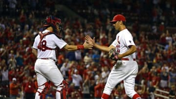 Sep 22, 2015; St. Louis, MO, USA; St. Louis Cardinals relief pitcher Steve Cishek (28) celebrates with catcher Tony Cruz (48) after defeating the Cincinnati Reds 3-1 at Busch Stadium. Mandatory Credit: Jeff Curry-USA TODAY Sports