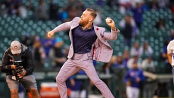 CHICAGO, IL - SEPTEMBER 21: Conor McGregor throws out a ceremonial first pitch prior to the game between the Minnesota Twins and Chicago Cubs on September 21, 2021 at Wrigley Field in Chicago, Illinois. (Photo by Brace Hemmelgarn/Minnesota Twins/Getty Images)