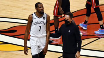 Brooklyn Nets forward Kevin Durant (7) holds his left leg as head coach Steve Nash assists him from the court(Jim Rassol-USA TODAY Sports)