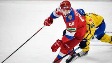 Toronto Maple Leafs newest import Kirill Semyonov (L) vies with Sweden's forward Matte Stromwall during the Channel One Cup of the Euro Hockey Tour ice hockey match between Sweden and Russia in Moscow at CSKA Arena on December 12, 2019. (Photo by Alexander NEMENOV / AFP) (Photo by ALEXANDER NEMENOV/AFP via Getty Images)