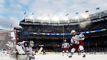 NEW YORK, NY - JANUARY 26: (EDITORIAL USE ONLY) Henrik Lundqvist #30 of the New York Rangers defends against the New Jersey Devils during the 2014 Coors Light NHL Stadium Series at Yankee Stadium on January 26, 2014 in the Bronx borough of New York City. (Photo by Bruce Bennett/Getty Images)