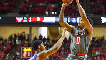 LUBBOCK, TX - JANUARY 05: Kyler Edwards #0 of the Texas Tech Red Raiders shoots the ball over Shaun Neal-Williams #1 of the Kansas State Wildcats during the first half of the game on January 5, 2019 at United Supermarkets Arena in Lubbock, Texas. (Photo by John Weast/Getty Images)