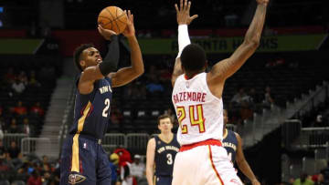 Oct 18, 2016; Atlanta, GA, USA; New Orleans Pelicans guard Buddy Hield (24) attempts a shot against Atlanta Hawks forward Kent Bazemore (24) in the first quarter of their game at Philips Arena. Mandatory Credit: Jason Getz-USA TODAY Sports