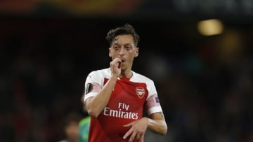 Arsenal's German midfielder Mesut Ozil celebrates scoring the team's fourth goal during the UEFA Europa League group E football match between Arsenal and Vorskla Poltava at the Emirates Stadium in London on September 20, 2018. (Photo by Ian KINGTON / AFP) (Photo credit should read IAN KINGTON/AFP/Getty Images)