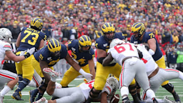 ANN ARBOR, MI - NOVEMBER 30: Malik Harrison #39 of the Ohio State Buckeyes recovers the fumble by Shea Patterson #2 of the Michigan Wolverines during the second quarter of the game at Michigan Stadium on November 30, 2019 in Ann Arbor, Michigan. (Photo by Leon Halip/Getty Images)