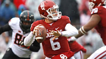NORMAN, OK - DECEMBER 3: Quarterback Baker Mayfield #6 of the Oklahoma Sooners looks to throw during the game against the Oklahoma State Cowboys December 3, 2016 at Gaylord Family-Oklahoma Memorial Stadium in Norman, Oklahoma. Oklahoma defeated Oklahoma State 38-20 to become Big XII champions. (Photo by Brett Deering/Getty Images)