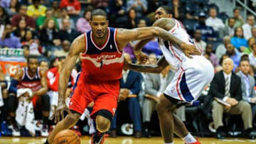 Feb 19, 2014; Atlanta, GA, USA; Washington Wizards small forward Trevor Ariza (1) drives past Atlanta Hawks shooting guard Louis Williams (3) along the baseline in the first quarter at Philips Arena. Mandatory Credit: Daniel Shirey-USA TODAY Sports
