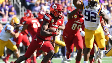 Dec 31, 2016; Orlando , FL, USA; Louisville Cardinals quarterback Lamar Jackson (8) runs the ball against the LSU Tigers during the second half of the Buffalo Wild Wings Citrus Bowl at Camping World Stadium. The LSU Tigers defeated the Louisville Cardinals 29-9. Mandatory Credit: Jonathan Dyer-USA TODAY Sports