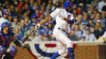 October 20, 2015; Chicago, IL, USA; Chicago Cubs center fielder Dexter Fowler (24) hits a double in the eighth inning against the New York Mets in game three of the NLCS at Wrigley Field. Mandatory Credit: Dennis Wierzbicki-USA TODAY Sports