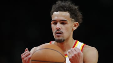 ATLANTA, GA - MARCH 14: Trae Young #11 of the Atlanta Hawks spends the ball in preparation for a free throw during the second half against the Portland Trail Blazers at State Farm Arena on March 14, 2022 in Atlanta, Georgia. NOTE TO USER: User expressly acknowledges and agrees that, by downloading and or using this photograph, User is consenting to the terms and conditions of the Getty Images License Agreement. (Photo by Todd Kirkland/Getty Images)