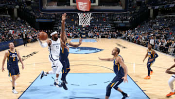 MEMPHIS, TN - NOVEMBER 12: Mike Conley #11 of the Memphis Grizzlies passes the ball against the Utah Jazz on November 12, 2018 at FedExForum in Memphis, Tennessee. NOTE TO USER: User expressly acknowledges and agrees that, by downloading and/or using this photograph, user is consenting to the terms and conditions of the Getty Images License Agreement. Mandatory Copyright Notice: Copyright 2018 NBAE (Photo by Joe Murphy/NBAE via Getty Images)