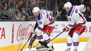LOS ANGELES, CA - MARCH 25: Jimmy Vesey #26 and Kevin Hayes #13 of the New York Rangers battle for the puck during the game against the Los Angeles Kings on March 25, 2017 at Staples Center in Los Angeles, California. (Photo by Aaron Poole/NHLI via Getty Images) *** Local Caption ***