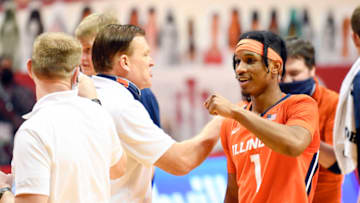 Feb 2, 2021; Bloomington, Indiana, USA; IIllinois Fighting Illini guard Trent Frazier (1) bumps fists with coaches after defeating the Indiana Hoosiers at Simon Skjodt Assembly Hall. Mandatory Credit: Marc Lebryk-USA TODAY Sports