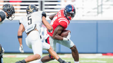 OXFORD, MS - OCTOBER 14: Wide receiver D.K. Metcalf #14 of the Mississippi Rebels looks to maneuver the ball by safety LaDarius Wiley #5 of the Vanderbilt Commodores at Vaught-Hemingway Stadium on October 14, 2017 in Oxford, Mississippi. (Photo by Michael Chang/Getty Images)