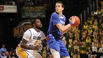 Feb 16, 2013; Fairfax, VA, USA; Georgia State Panthers guard R.J. Hunter (22) looks to pass in front of George Mason Patriots guard Bryon Allen (0) during the first half at Patriot Center. Mandatory Credit: Rafael Suanes-USA TODAY Sports