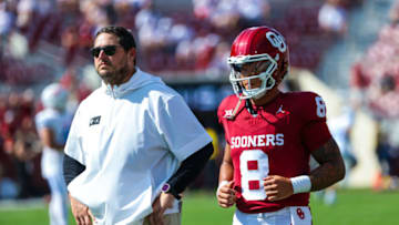 Sep 9, 2023; Norman, Oklahoma, USA; Oklahoma Sooners quarterback Dillon Gabriel (8) warms up in front of offensive coordinator Jeff Lebby before the game against the Southern Methodist Mustangs at Gaylord Family-Oklahoma Memorial Stadium. Mandatory Credit: Kevin Jairaj-USA TODAY Sports