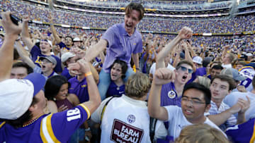 BATON ROUGE, LA - OCTOBER 13: LSU Tigers students celebrate on the field after a game against the Georgia Bulldogs at Tiger Stadium on October 13, 2018 in Baton Rouge, Louisiana. LSU Tigers won 36-16. (Photo by Jonathan Bachman/Getty Images)