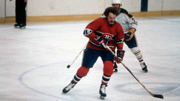 BUFFALO, NY - CIRCA 1980: Larry Robinson #19 of the Montreal Canadiens skates against the Buffalo Sabers during an NHL Hockey game circa 1980 at the Buffalo Memorial Auditorium in Buffalo, New York. Robinson's playing career went from 1973-92. (Photo by Focus on Sport/Getty Images)