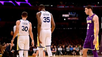 LOS ANGELES, CA - NOVEMBER 29: Lonzo Ball #2 of the Los Angeles Lakers looks at Stephen Curry #30 and Kevin Durant #35 of the Golden State Warriors during the first half at Staples Center on November 29, 2017 in Los Angeles, California. (Photo by Harry How/Getty Images)