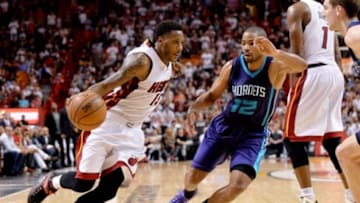 Nov 23, 2014; Miami, FL, USA; Miami Heat guard Shabazz Napier (13) drives to the basket as Charlotte Hornets guard Gary Neal (12) defends during the second half at American Airlines Arena. 94-93. Mandatory Credit: Steve Mitchell-USA TODAY Sports
