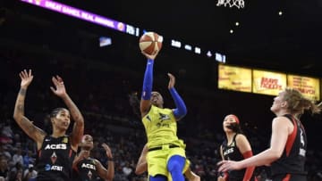LAS VEGAS, NV - JUNE 22: Arike Ogunbowale #24 of the Dallas Wings puts up the shot against the Las Vegas Aces on June 22, 2019 at the Mandalay Bay Events Center in Las Vegas, Nevada. NOTE TO USER: User expressly acknowledges and agrees that, by downloading and or using this photograph, User is consenting to the terms and conditions of the Getty Images License Agreement. Mandatory Copyright Notice: Copyright 2019 NBAE (Photo by David Becker/NBAE via Getty Images)