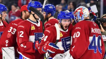 LAVAL, QC - JANUARY 18: Daniel Audette #24 of the Laval Rocket congratulates goaltender Michael McNiven #40 for their victory against the Cleveland Monsters during the AHL game at Place Bell on January 18, 2019 in Laval, Quebec, Canada. The Laval Rocket defeated the Cleveland Monsters 1-0. (Photo by Minas Panagiotakis/Getty Images)