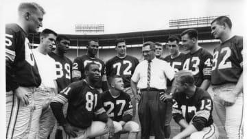 1963: Green Bay Coach Vince Lombardi gives his rookies the lowdown on what to expect in a Packers-Bears game at Milwaukee County Stadium on Aug. 23, 1963. The first-year players are: Marv Fleming (kneeling, from left), Gary Kroner and Terry Zang; and Ed Holler (standing, from left), Chuck Morris, Dave Robinson, Lionel Aldridge, Tony Liscio, Dan Grimm, Bob Ames, Doug Hart and Jan Barrett. This photo was in the Aug. 24, 1963, Milwaukee Sentinel. In the game on Aug. 24, the Packers beat the Bears, 24-7.Green Bay Packers Chicago Bears in Milwaukee 1963