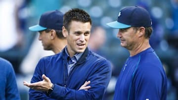 Apr 25, 2016; Seattle, WA, USA; Seattle Mariners manager Scott Servais (9, right) talks with general manager Jerry Dipoto during batting practice before a game against the Houston Astros at Safeco Field. Mandatory Credit: Joe Nicholson-USA TODAY Sports