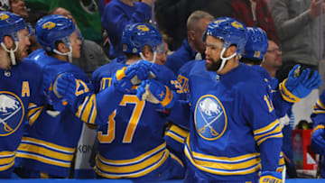 Mar 9, 2023; Buffalo, New York, USA; Buffalo Sabres left wing Jordan Greenway (12) celebrates his goal with teammates during the first period against the Dallas Stars at KeyBank Center. Mandatory Credit: Timothy T. Ludwig-USA TODAY Sports