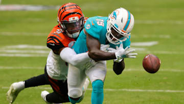 MIAMI GARDENS, FLORIDA - DECEMBER 06: Wide receiver Jakeem Grant #19 of the Miami Dolphins can't make the catch as cornerback LeShaun Sims #38 of the Cincinnati Bengals makes the tackle in the second quarter of the game at Hard Rock Stadium on December 06, 2020 in Miami Gardens, Florida. (Photo by Michael Reaves/Getty Images)
