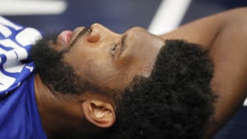 Feb 25, 2022; Minneapolis, Minnesota, USA; Philadelphia 76ers center Joel Embiid (21) stretches as he prepares to play the Minnesota Timberwolves at Target Center. Mandatory Credit: Bruce Kluckhohn-USA TODAY Sports