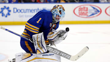 Jan 19, 2023; Buffalo, New York, USA; Buffalo Sabres goaltender Ukko-Pekka Luukkonen (1) makes a glove save during the third period against the New York Islanders at KeyBank Center. Mandatory Credit: Timothy T. Ludwig-USA TODAY Sports