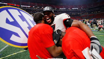 ATLANTA, GA - DECEMBER 02: Isaiah Wynn #77 of the Georgia Bulldogs celebrates beating the Auburn Tigers in the SEC Championship at Mercedes-Benz Stadium on December 2, 2017 in Atlanta, Georgia. (Photo by Kevin C. Cox/Getty Images)