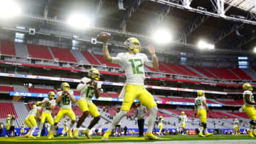 Jan 2, 2021; Glendale, AZ, USA; Oregon quarterback Tyler Shough (12) throws passes before the Fiesta Bowl game against Iowa State at State Farm Stadium. Mandatory Credit: Patrick Breen-USA TODAY Sports