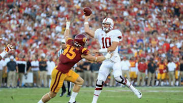 LOS ANGELES, CA - SEPTEMBER 09: Keller Chryst #10 of the Stanford Cardinal throws a touchdown pass during the second quarter as he is pressured by Porter Gustin #45 of the USC Trojans at Los Angeles Memorial Coliseum on September 9, 2017 in Los Angeles, California. (Photo by Sean M. Haffey/Getty Images)