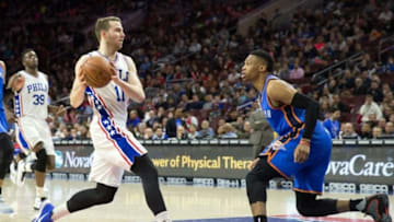 Mar 18, 2016; Philadelphia, PA, USA; Philadelphia 76ers guard Nik Stauskas (11) drives against Oklahoma City Thunder guard Russell Westbrook (0) during the second half at Wells Fargo Center. The Oklahoma City Thunder won 111-97.Mandatory Credit: Bill Streicher-USA TODAY Sports