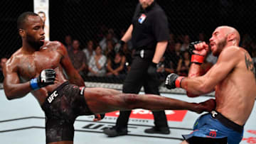 SINGAPORE - JUNE 23: (L-R) Leon Edwards of Jamaica kicks Donald Cerrone in their welterweight bout during the UFC Fight Night event at the Singapore Indoor Stadium on June 23, 2018 in Singapore. (Photo by Jeff Bottari/Zuffa LLC/Zuffa LLC via Getty Images)