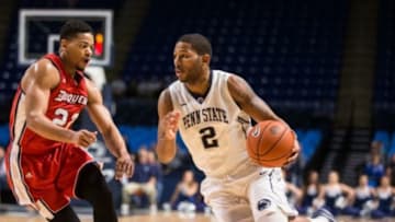 Dec 10, 2014; University Park, PA, USA; Duquesne Dukes forward Jeremiah Jones (23) defends as Penn State Nittany Lions guard D.J. Newbill (2) drives to the basket at Bryce Jordan Center. Penn State defeats Duquesne 64-62. Mandatory Credit: Brett Carlsen-USA TODAY Sports