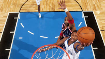 ORLANDO, FL - JANUARY 8: Tracy McGrady #1 of the Orlando Magic goes up for the layup during the NBA game against the Houston Rockets at TD Waterhouse Centre on January 8, 2003 in Orlando, Florida. The Rockets won 91-81. NOTE TO USER: User expressly acknowledges and agrees that, by downloading and or using this Photograph, User is consenting to the terms and conditions of the Getty Images License Agreement. Mandatory Copyright Notice: Copyright 2003 NBAE (Photo by Fernando Medina/NBAE/Getty Images)