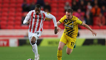 STOKE ON TRENT, ENGLAND - OCTOBER 18: Dujon Sterling of Stoke City runs past Shane Ferguson of Rotherham United during the Sky Bet Championship between Stoke City and Rotherham United at Bet365 Stadium on October 18, 2022 in Stoke on Trent, England. (Photo by Nathan Stirk/Getty Images)